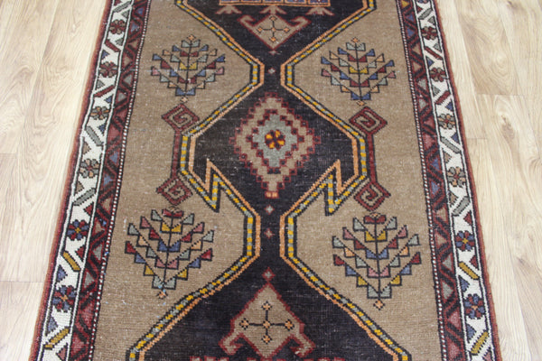 Antique Persian Heriz runner of traditional medallion design 390 x 95 cm