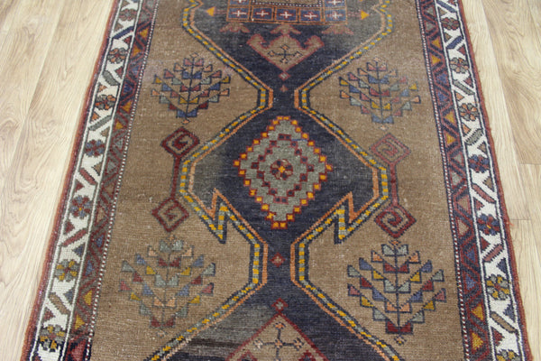 Antique Persian Heriz runner of traditional medallion design 390 x 95 cm