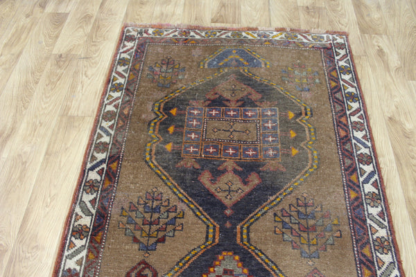 Antique Persian Heriz runner of traditional medallion design 390 x 95 cm