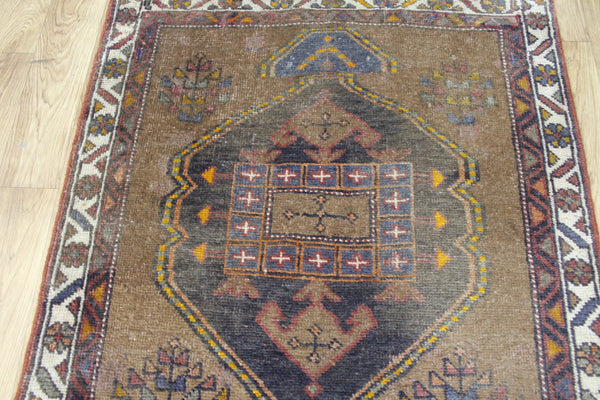 Antique Persian Heriz runner of traditional medallion design 390 x 95 cm