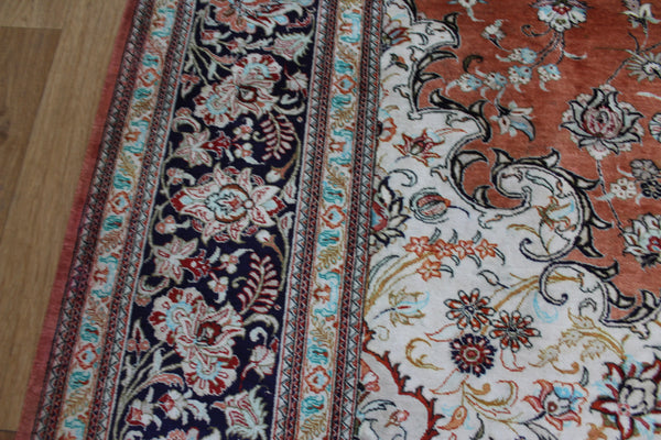 A good example of a Persian Qum silk rug with fine weave and floral design 300 x 200 cm