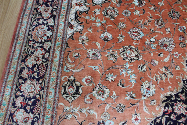 A good example of a Persian Qum silk rug with fine weave and floral design 300 x 200 cm