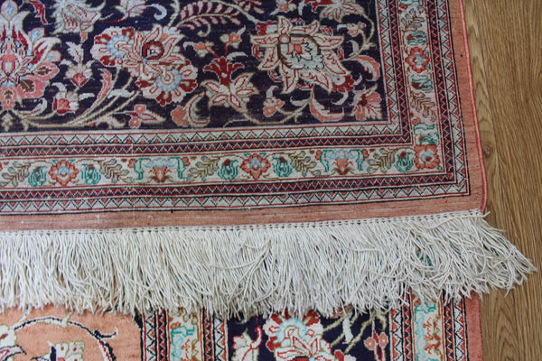 A good example of a Persian Qum silk rug with fine weave and floral design 300 x 200 cm