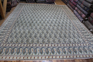 SIGNED PERSIAN KASHAN CARPET, IVORY GROUND WITH ALL OVER BOTEH DESIGN, CIRCA 1920.